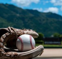 Baseball,Field,In,Summer,With,A,View,Of,The,Mountains