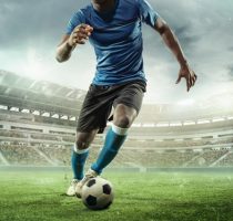 Cropped,Image,Of,Running,Soccer,,Football,Player,At,Stadium,During