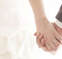 Young,Married,Couple,Holding,Hands,,Ceremony,Wedding,Day